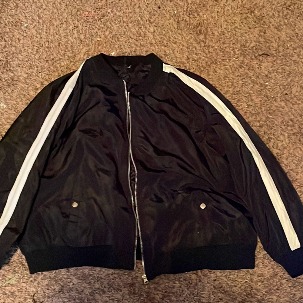 Black jacket with white stripes on sleeves in size 3X, very lightly used.